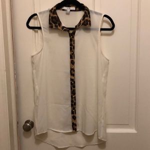 White sleeveless buttondown with leopard trim